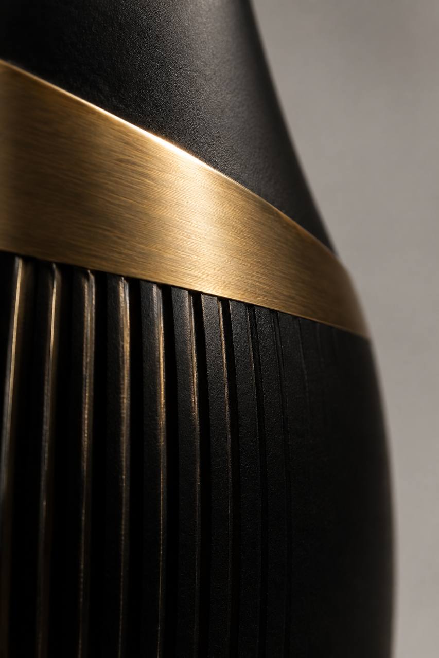 Macro detail where the brass collar meets the black lacquer on L'Éclipse