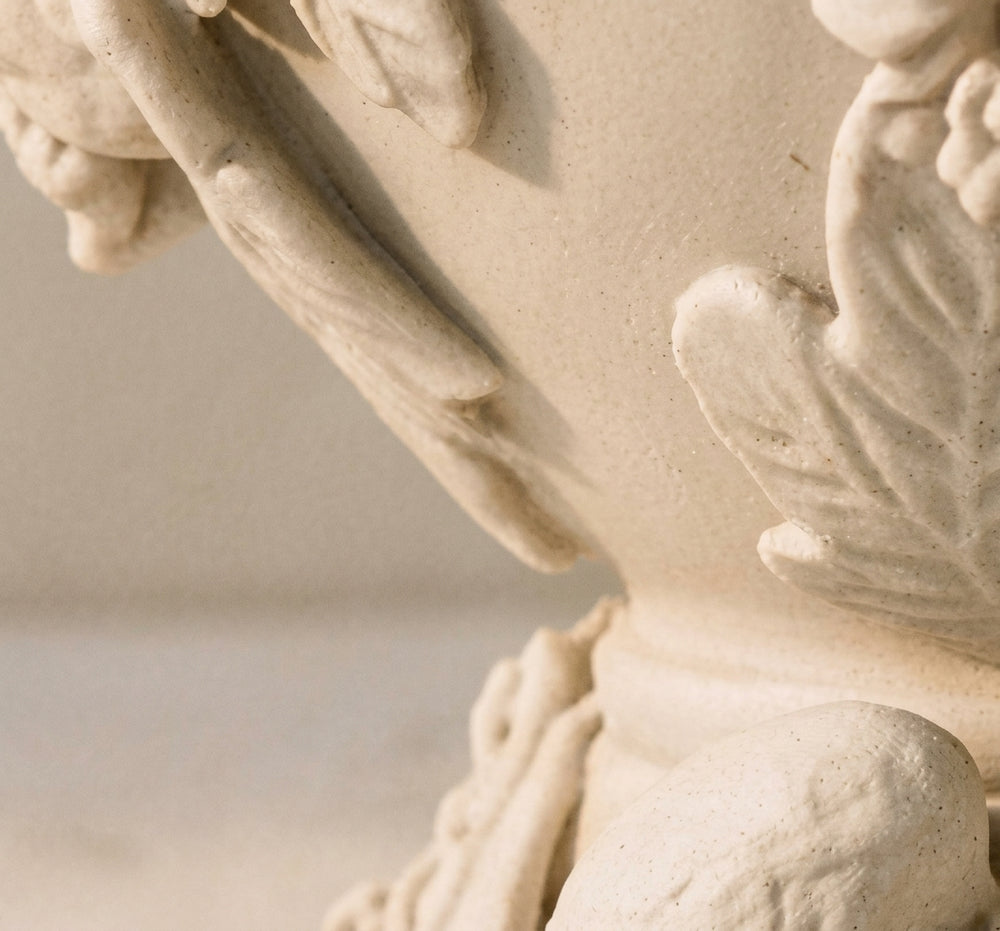 Macro detail of the leaf relief carved across La Couvée's shell
