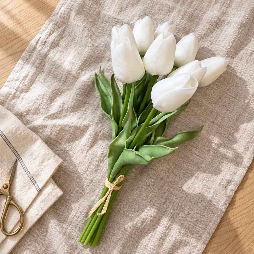 Forever Tulips in White, tied with raffia on a linen cloth